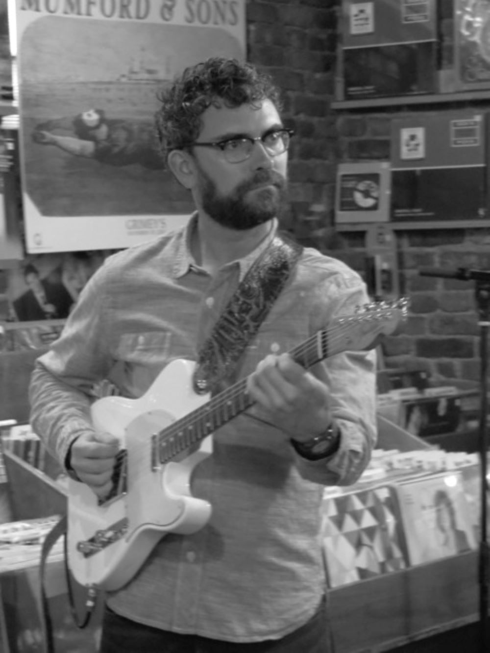 Adam Davis holding a Telecaster guitar